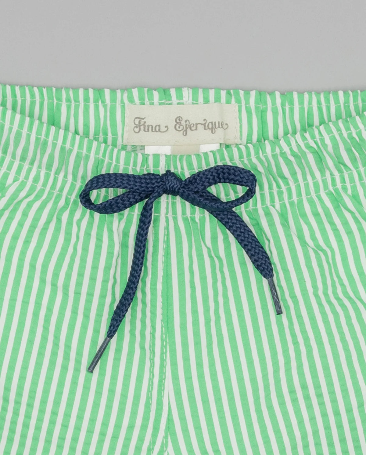 Pantaloneta de rayas verdes con bolsillo